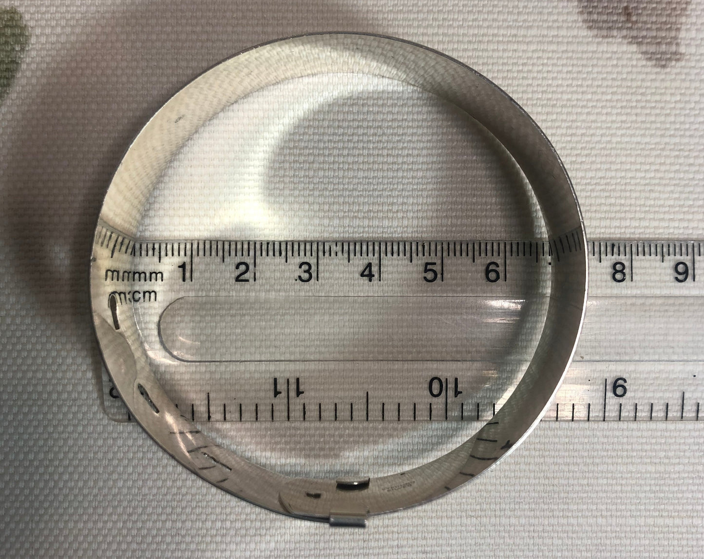 Sterling silver engine turned buckle cuff bangle bracelet. 68mm inside diameter.
